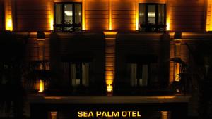 an image of a building at night with lights at Sea Palm Otel Yalıkavak in Yalıkavak