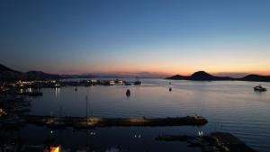 a view of a body of water at dusk at Sea Palm Otel Yalıkavak in Yalıkavak