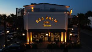 a restaurant with a sign that reads sea palana oilledged at Sea Palm Otel Yalıkavak in Yalıkavak