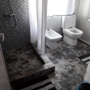a bathroom with a toilet and a sink at Residence Devika2 Trou aux Biches in Trou aux Biches