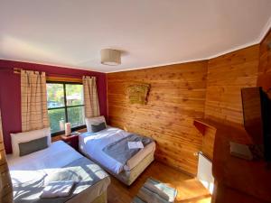 Postel nebo postele na pokoji v ubytování Hotel Andes Pucón