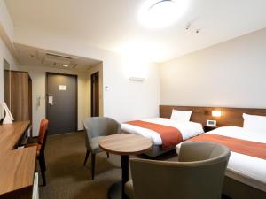Voodi või voodid majutusasutuse Tokyo Inn toas