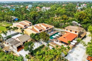 an aerial view of a house with a swimming pool at Hoi An May Village in Hoi An