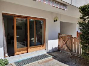 a sliding glass door on the side of a house at Appartement Nevada 104 Spa in La Tzoumaz