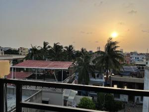 a view of the city from the balcony of a building at Sukhmani Homestays in Kolkata