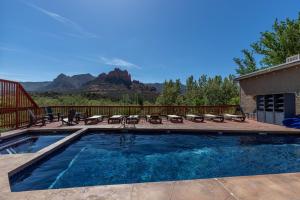 a swimming pool with a view of a mountain at Cedars Resort in Sedona