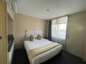 Postel nebo postele na pokoji v ubytování Astor Hotel Motel