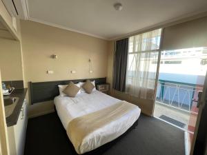 Postel nebo postele na pokoji v ubytování Astor Hotel Motel