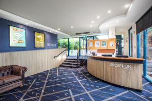 a lobby of a hotel with a reception desk at Burvale Hotel in Nunawading