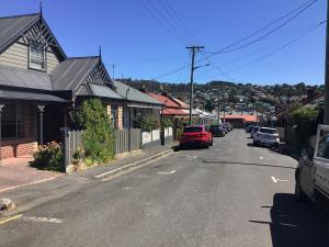 a street with cars parked on the side of the road at City townhouse walking distance to city in Launceston