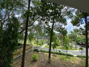 a view through the trees of a street at Hotel Home in Ho Chi Minh City