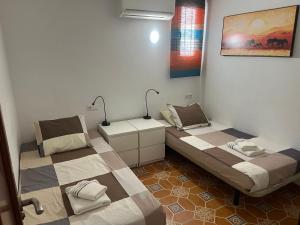 Posteľ alebo postele v izbe v ubytovaní Apartments Bahia Dorada