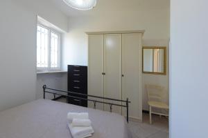 Кровать или кровати в номере Villetta Terme di Torre Canne