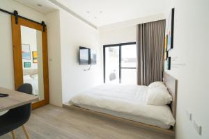 Tempat tidur dalam kamar di The Way Inn