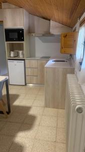 Kuchyň nebo kuchyňský kout v ubytování Hostal La Cabanya