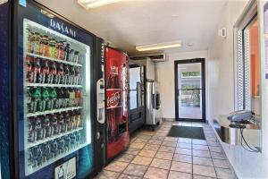 a soda machine in a building with soda cans at Motel 6-Abilene, TX in Abilene