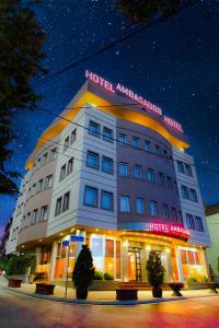 a hotel amsterdam with a sign on top of it at Hotel Ambasador Prishtina in Pristina