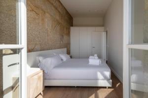 Postel nebo postele na pokoji v ubytování Bow Homes by Como en Casa
