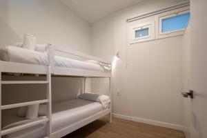 Postel nebo postele na pokoji v ubytování Bow Homes by Como en Casa