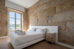 Postel nebo postele na pokoji v ubytování Bow Homes by Como en Casa