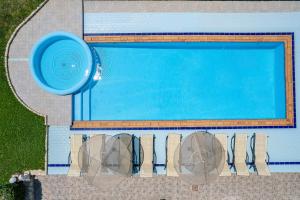 an overhead view of a swimming pool at Anthos Apartments in Plakias