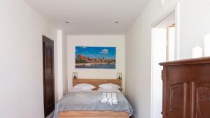 Posteľ alebo postele v izbe v ubytovaní Main Square Apartments