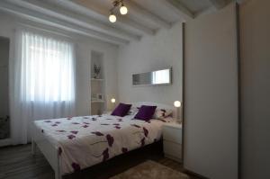 Postel nebo postele na pokoji v ubytování Apartment ALESSIA