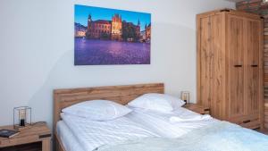 Posteľ alebo postele v izbe v ubytovaní Main Square Apartments