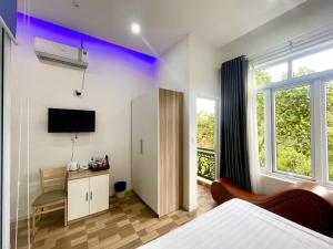 TV a/nebo společenská místnost v ubytování Homestay Tulip Garden Bảo Lộc