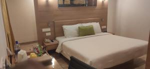 Voodi või voodid majutusasutuse Lemon Tree Hotel Coimbatore toas