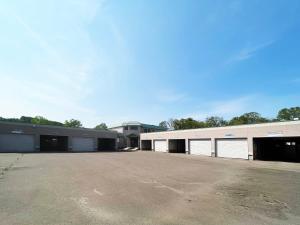 an empty parking lot in front of a building at Hotel ARUN-Adult Only in Abashiri