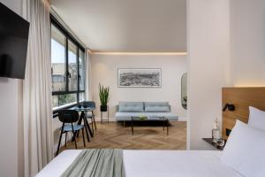 Postel nebo postele na pokoji v ubytování The Arbel Tel Aviv