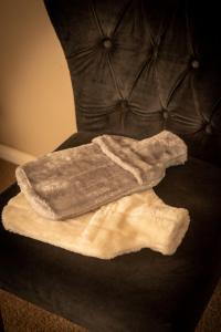 a towel sitting on top of a couch at The views!Lovely apartment on acreage with magnificent views, dog friendly in Panton Hill