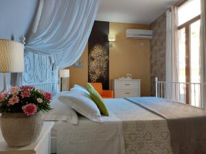 A bed or beds in a room at SWEET HOME & WELLNESS affittacamere