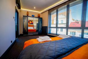 Posteľ alebo postele v izbe v ubytovaní Golden Apartments Centrum