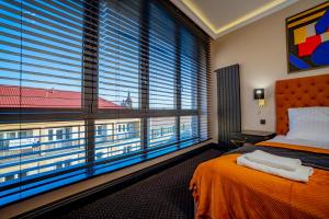 Posteľ alebo postele v izbe v ubytovaní Golden Apartments Centrum