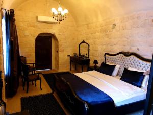 Postel nebo postele na pokoji v ubytování Aslanbey Konağı Butik Otel