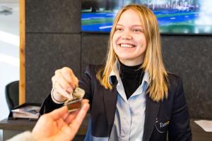 a woman is holding a object in her hand at EuroParcs Limburg in Susteren