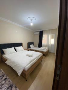 Ein Bett oder Betten in einem Zimmer der Unterkunft Kıvanç Residence
