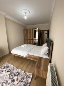 Ein Bett oder Betten in einem Zimmer der Unterkunft Kıvanç Residence