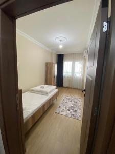 Ein Bett oder Betten in einem Zimmer der Unterkunft Kıvanç Residence
