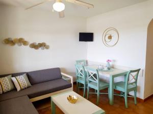 a living room with a couch and a table at Cheap & Chic Apartamentos en Son Bou de 2 dormitorios in Son Bou