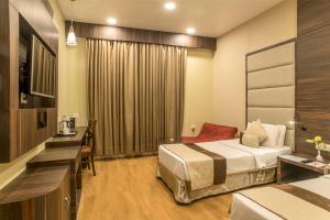 The Citi Residenci Hotel - Durgapur客房内的一张或多张床位