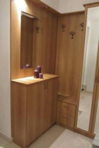 a bathroom with a shower with a sink and a mirror at Comfortable and beautiful apartment in Ploče