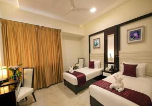 Postel nebo postele na pokoji v ubytování Hotel Star Palace - Rameswaram Tamil Nadu