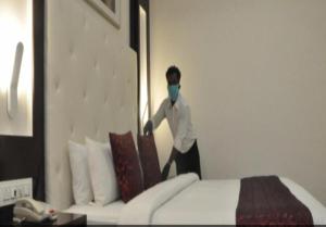 Postel nebo postele na pokoji v ubytování Hotel Star Palace - Rameswaram Tamil Nadu