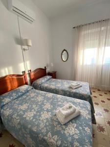 Postel nebo postele na pokoji v ubytování Tranvía Beach House