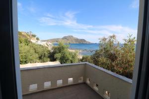 a view of the ocean from a balcony at Horizon Beach Hotel in Plakias