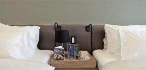 Ένα ή περισσότερα κρεβάτια σε δωμάτιο στο Radisson Blu Hotel, Beirut Verdun