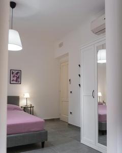 Ένα ή περισσότερα κρεβάτια σε δωμάτιο στο La Terrazza Azzurra